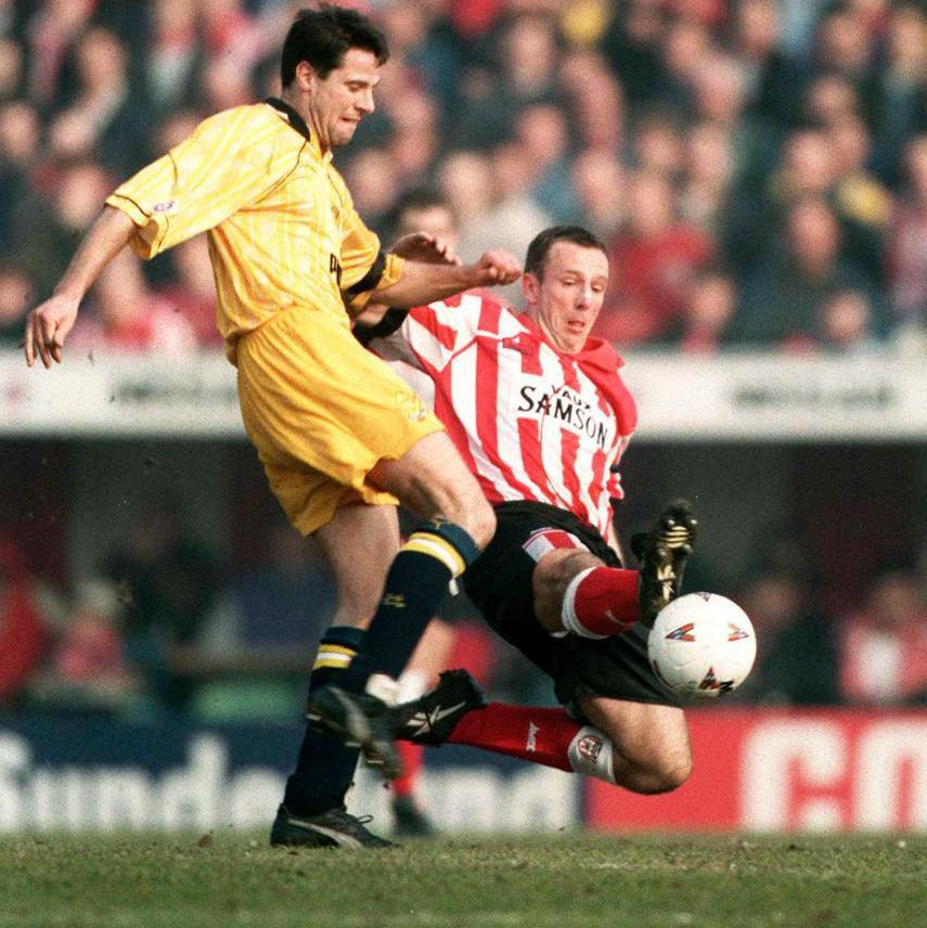 Kevin Ball challenges for the ball for Sunderland with one foot outstretched
