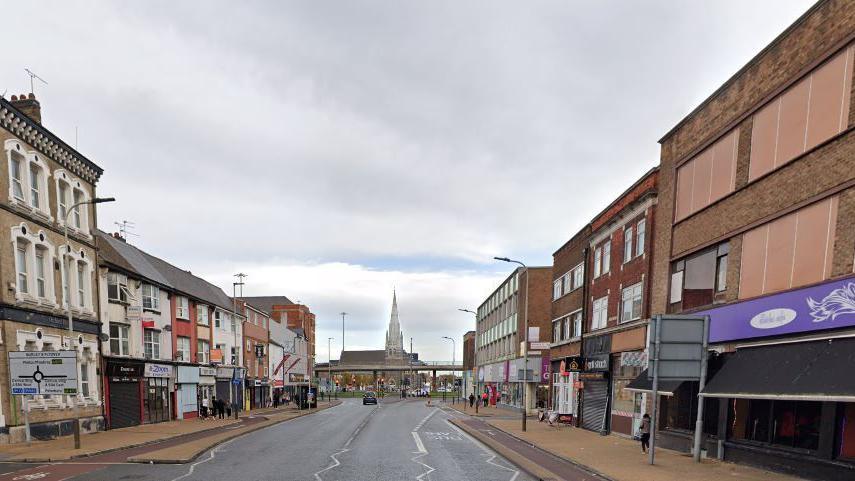 A street view from the middle of Belgrave Gate looking towards Burleys Flyover, with buildings on either side