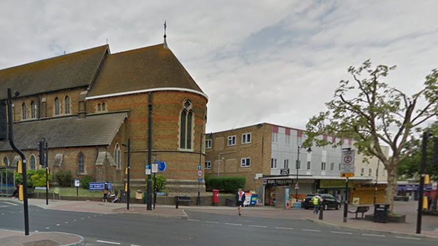 A Google street view of Gillingham High Street and Canterbury Street. In the corner there is a church building and a row of shops. 