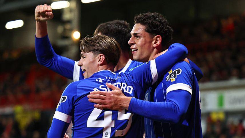 Cardiff City striker Yousef Salech (R) celebrates with Cian Ashford (L)