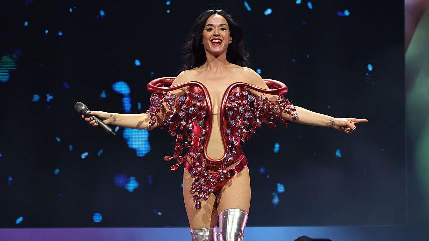 Katy Perry wearing a nude bodysuit and red bejewelled costume onstage in Mexico as part of her Lifetimes world tour