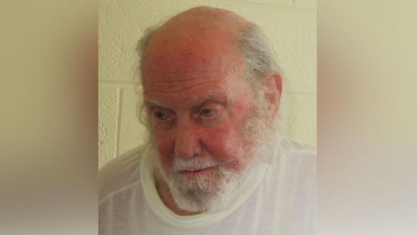A headshot of inmate Francis Clifford Smith gazing downwards