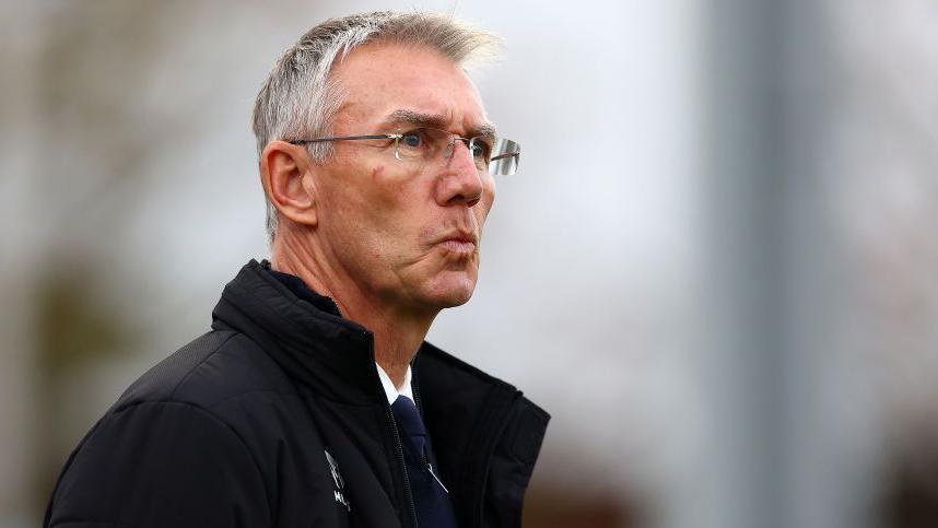 Nigel Adkins watching a match unfold