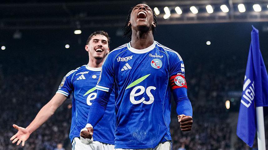 Strasbourg forward Emanuel Emegha celebrates goal against Lille with his partner Joachin Panichelli