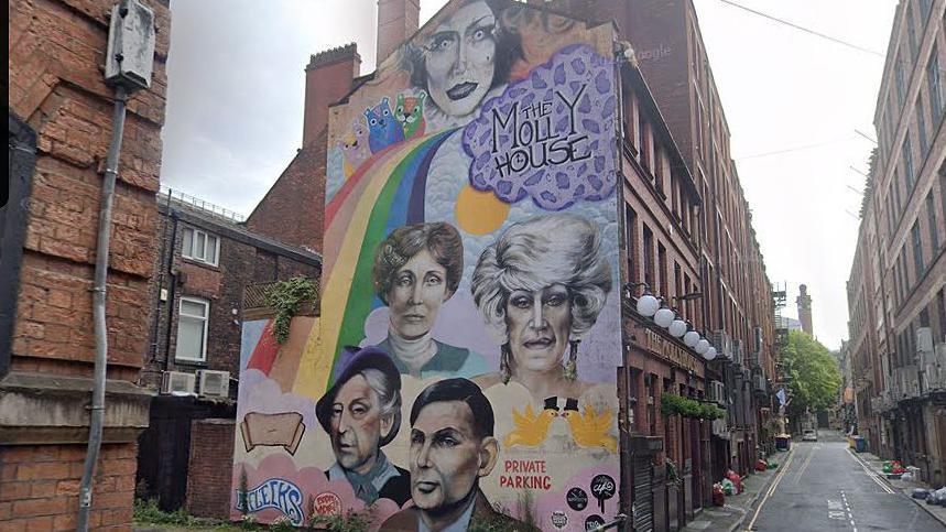 Mural on the Molly House pub wall in Richmond Street Manchester featuring (top left) Emmeline Pankhurst and (top right) Foo Foo Lammar and (bottom left) Quentin Crisp (left) and Alan Turing (bottom right)