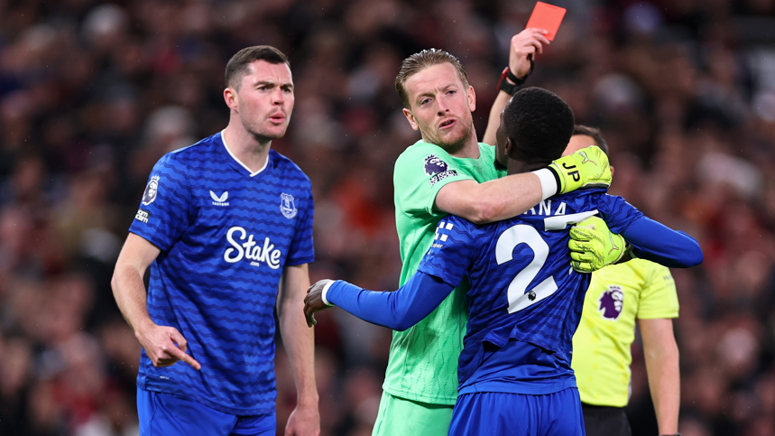 Everton's Idrissa Gana Gueye receives a red card after a clash with team-mate Michael Keane