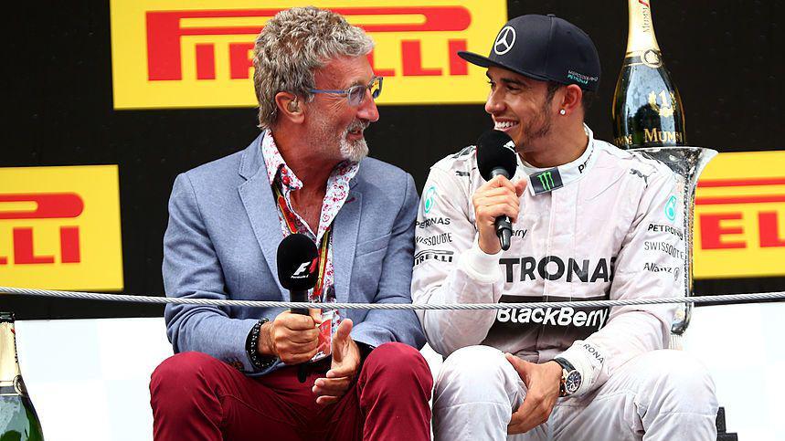 Eddie Jordan sat down while interviewing Lewis Hamilton on the podium following the 2014 Spanish Grand Prix