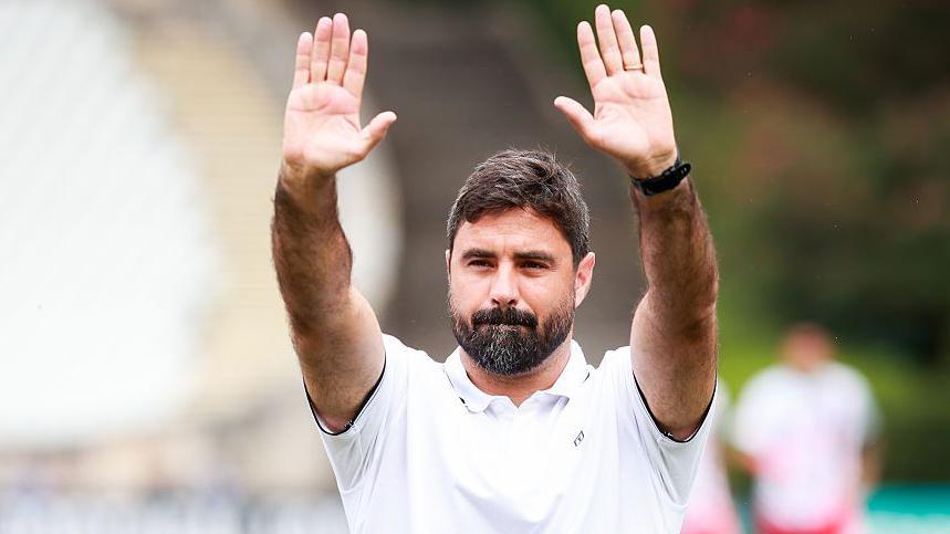 Vitor Matos waves to fans 