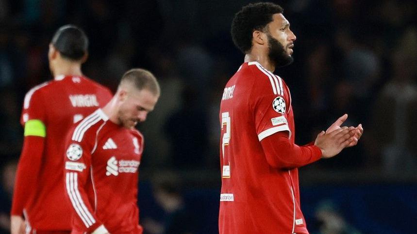 Liverpool's players react after losing to Paris St-Germain in the Champions League