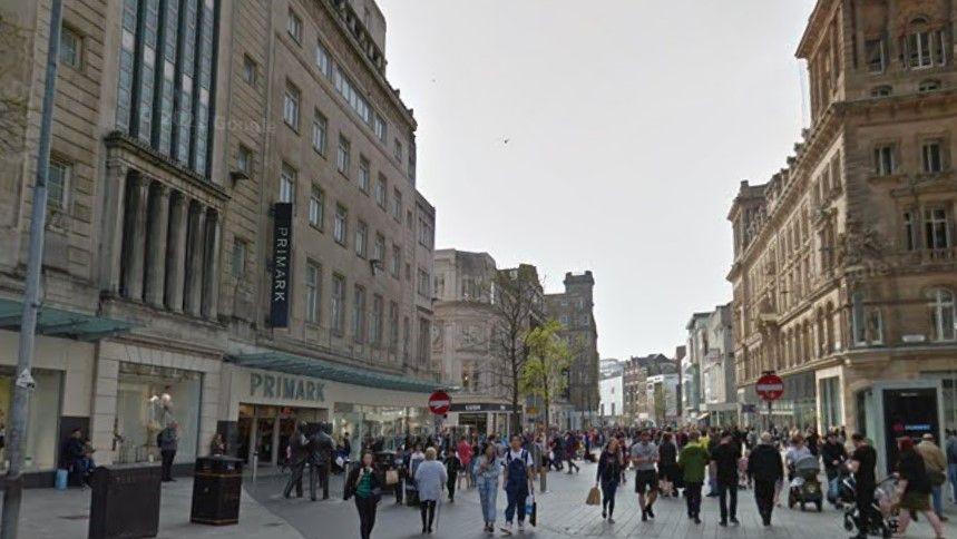 Crowds of people walking along Church Street next to Primark in Liverpool city centre.