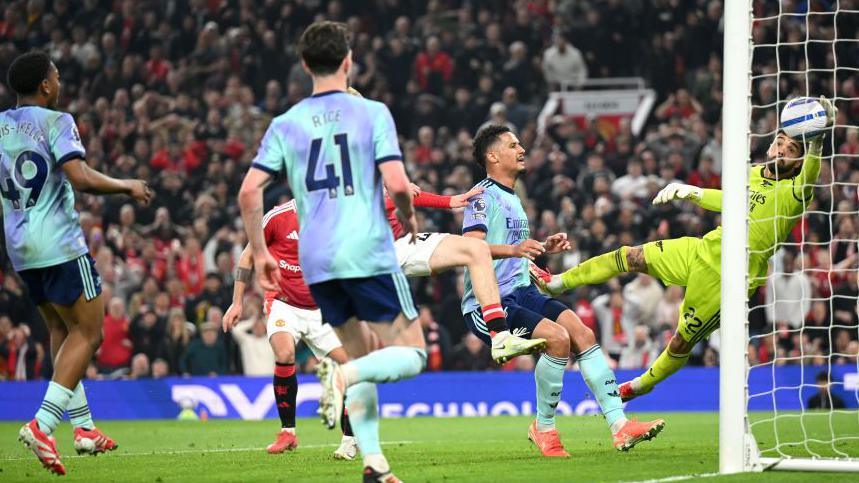 Arsenal needed a miraculous injury time save by keeper David Raya from Bruno Fernandes to prevent defeat at Manchester United