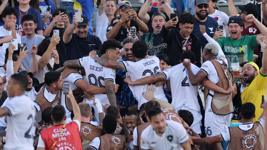 Botafogo's players celebrate with their fans after scoring against Paris St-Germain at the Club World Cup
