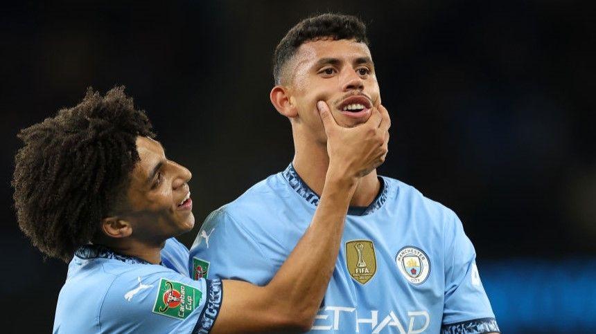 Rico Lewis (left) helps Matheus Nunes celebrate his first Manchester City goal in the EFL Cup third round tie with Watford