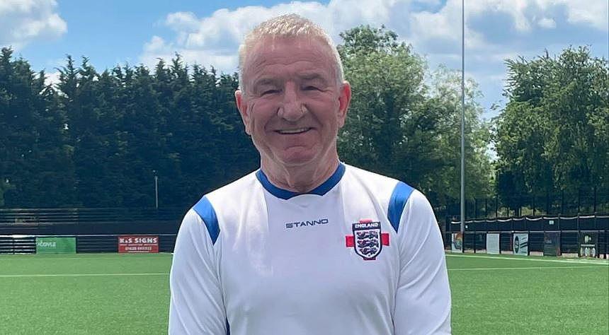 Mike Sweeney in his England football kit on a football pitch