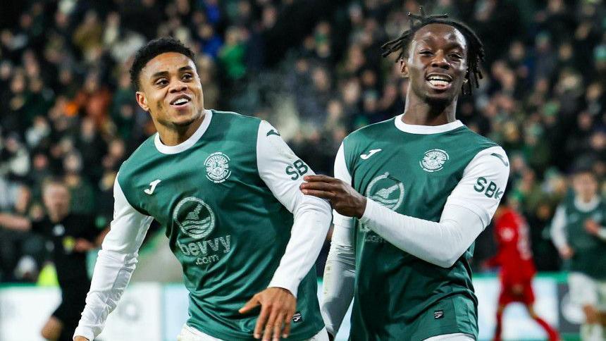 Hibernian's Thibault Klidje (L) celebrates scoring to make it 1-0 with teammate Kanayo Megwa during a William Hill Premiership match between Hibernian and Aberdeen at Easter Road, on December 30, 2025, in Edinburgh