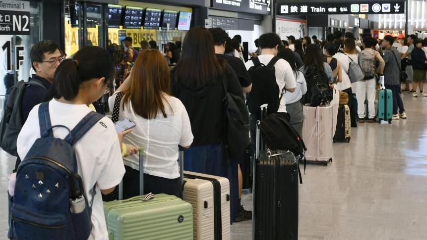 People stranded due to heavy rain crowd Narita International Airport