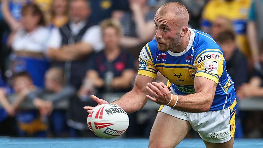Leeds Rhinos' Jarrod O'Connor passing the ball during Super League match between Leeds Rhinos and Warrington Wolves last season