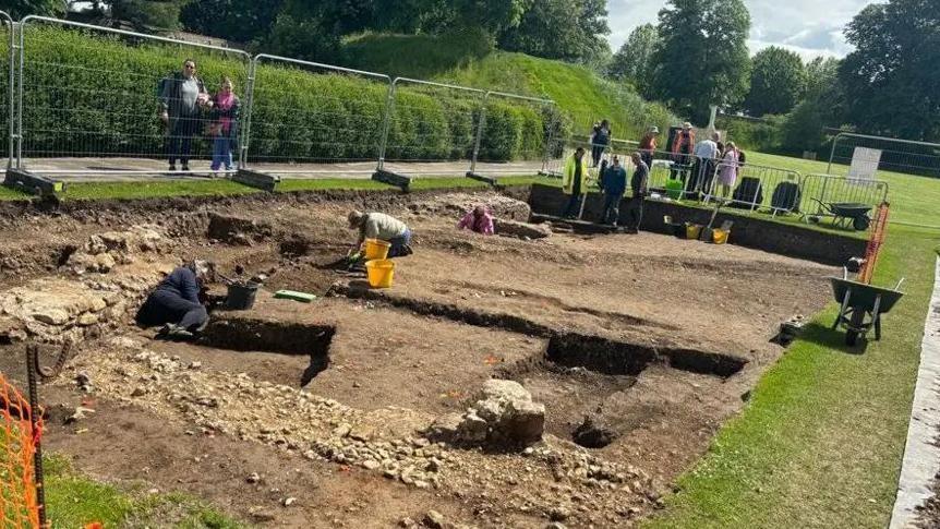 An archaeological dig taking part to uncover remains of a Norman Castle in Chichester's Priory Park
