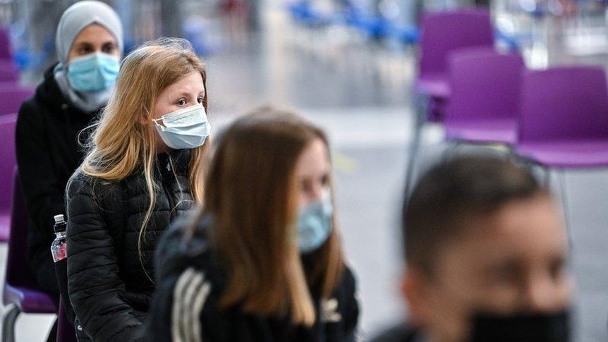 Children wearing masks in schools