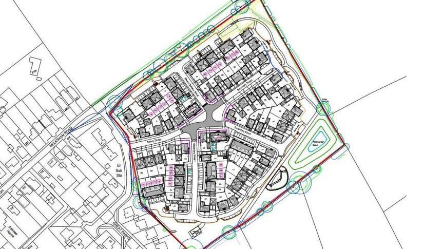 A draft showing the proposed layout of the housing development. The image is white with outlines showing roads and houses.