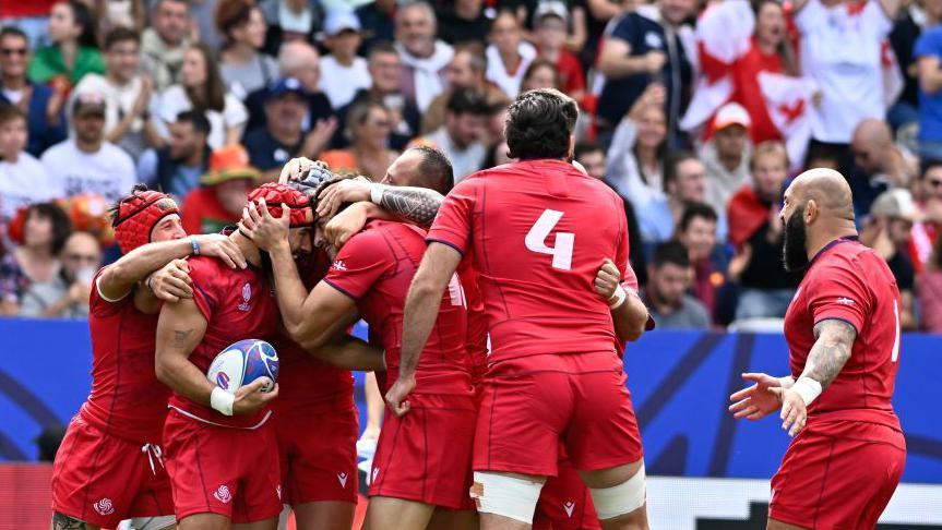 Georgian players celebrate scoring a try during their Rugby World Cup game with Portugal in 2023