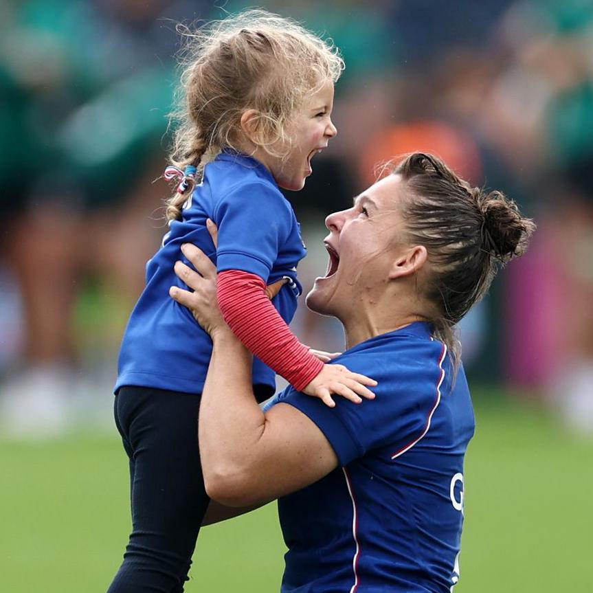 France's Agathe Gerin celebrates with a young fan after Les Bleues' Women's Rugby World Cup quarter-final win over Ireland at Sandy Park, Exeter. Photo by Dan Istitene