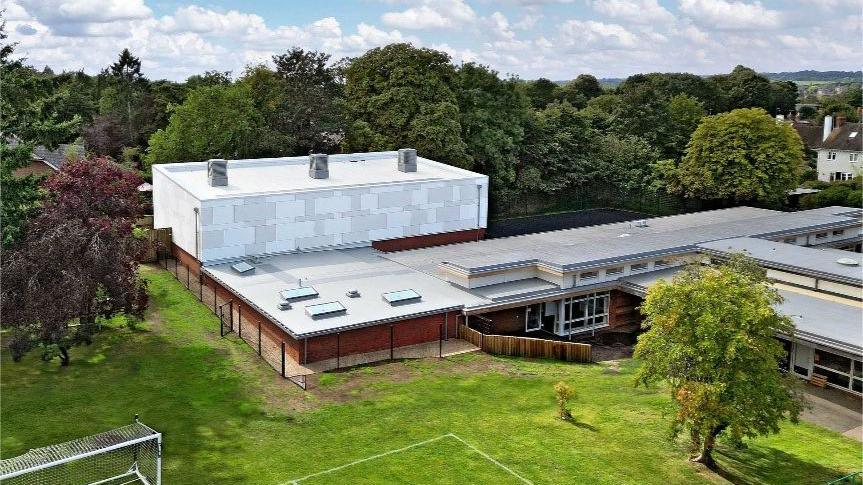 A modern-looking, new building is pictured from above