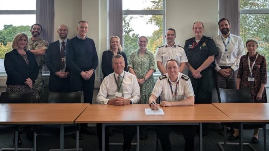 Members of Surrey Local Resilience Forum signing the Hillsborough Charter for Bereaved Families