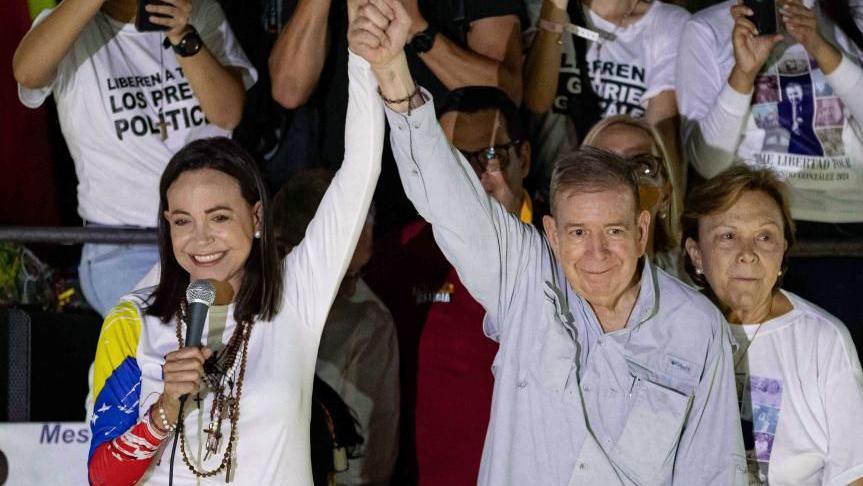 Venezuelan opposition leader Maria Corina Machado (L) and Venezuelan presidential candidate Edmundo Gonzalez Urrutia (R) greet supporters at Gonzalez Urrutia's campaign rally in Caracas, Venezuela, 25 July 2024.