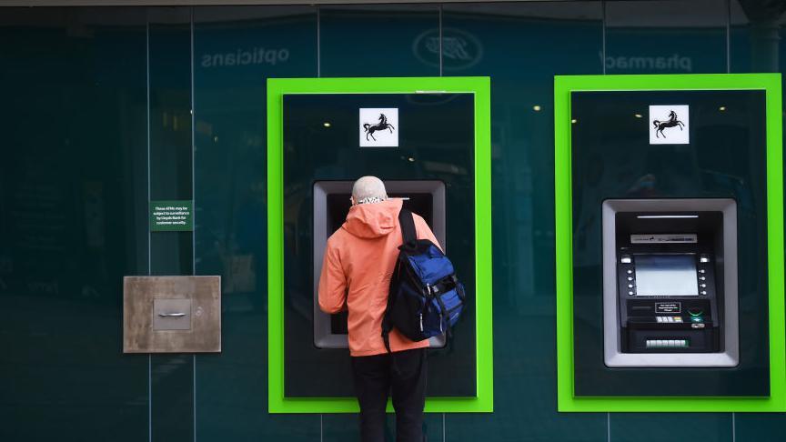 Man using a Lloyds Bank ATM