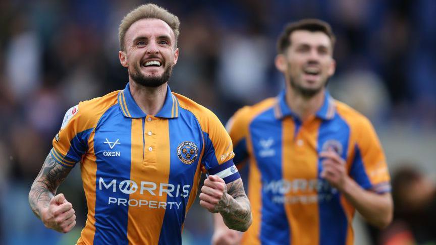 Carl Winchester celebrates scoring for Shrewsbury Town