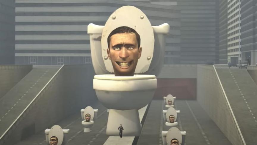An image shows a large smiling man's head coming out of a toilet bowl. There are smaller versions of the same picture surrounding the larger one.