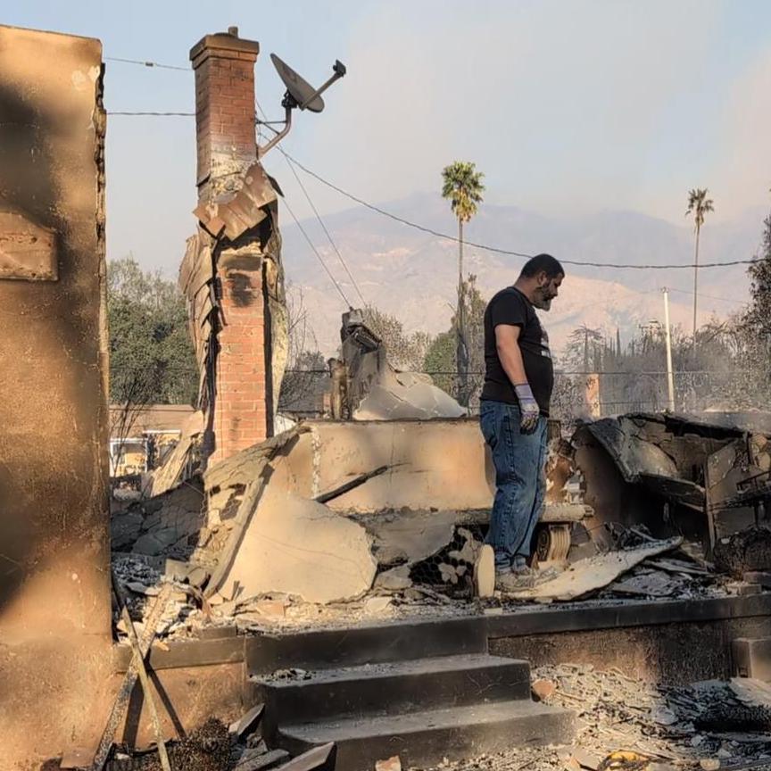 Hipolito Cisneros examines the charred remains of his home in aftermath of the Eaton Fire in California 