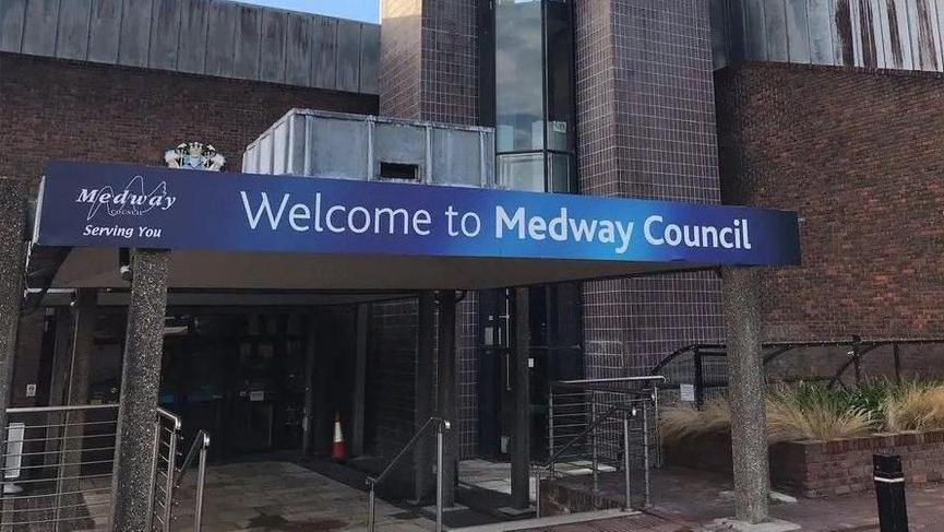 Medway Council's offices in Chatham with a large blue sign and white text