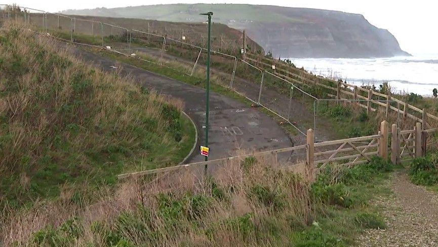 Cowbar Lane in Staithes, which surrounded by a protective fencing along the cliff face due to coastal erosion. 
