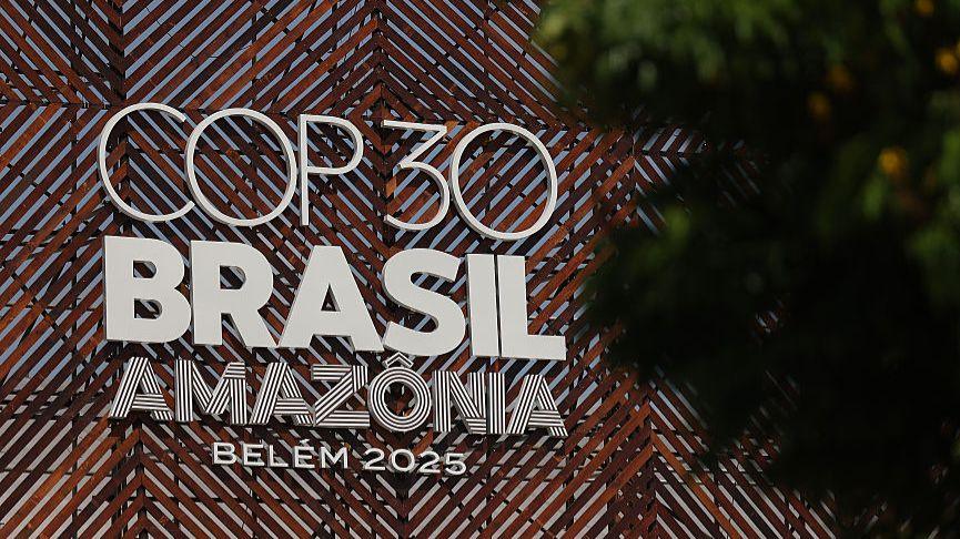 The COP30 sign with Brasil and Amazonia writing is seen through trees