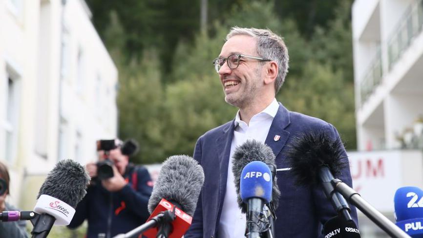 Herbert Kickl, Chairman of Far-right Freedom Party of Austria (FPO) speaks to press members after casting his vote in general elections in Vienna