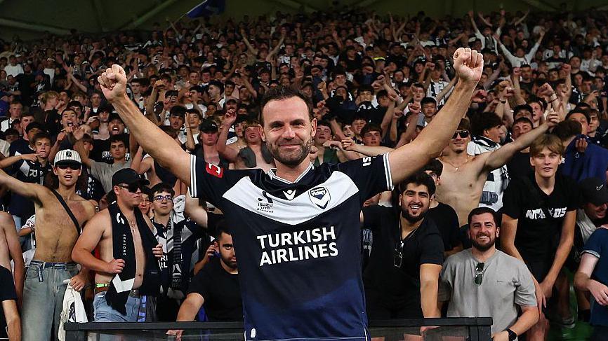 Juan Mata celebrates his goal in front of the Melbourne Victory fans 