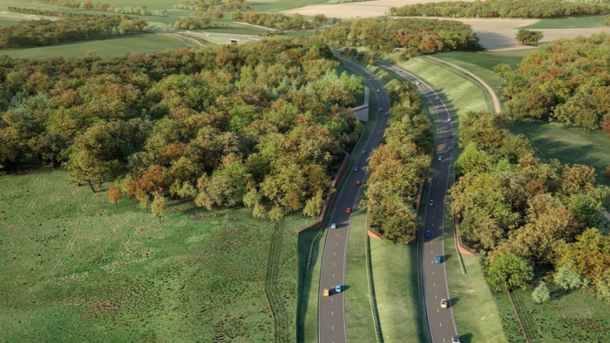 An image provided by Norfolk County Council showing how a section of the Western Link could look. It shows a number of cars on two curving lanes running through the countryside, with a mixture of fields and trees surrounding them.