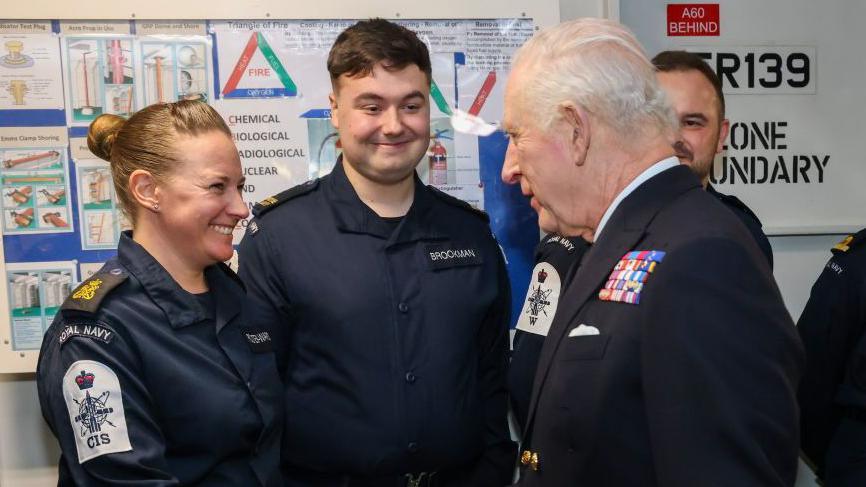 King Charles meets a servicewoman on the HMS Prince of Wales