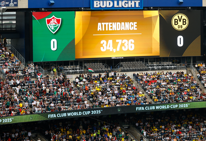 A scoreboard at Metlife Stadium showing the official attendance as 34,736