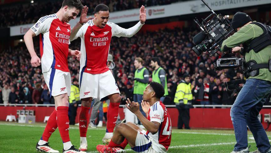 Arsenal's players celebrate with Myles Lewis-Skelly after his goal in the win over Manchester City at Emirates Stadium