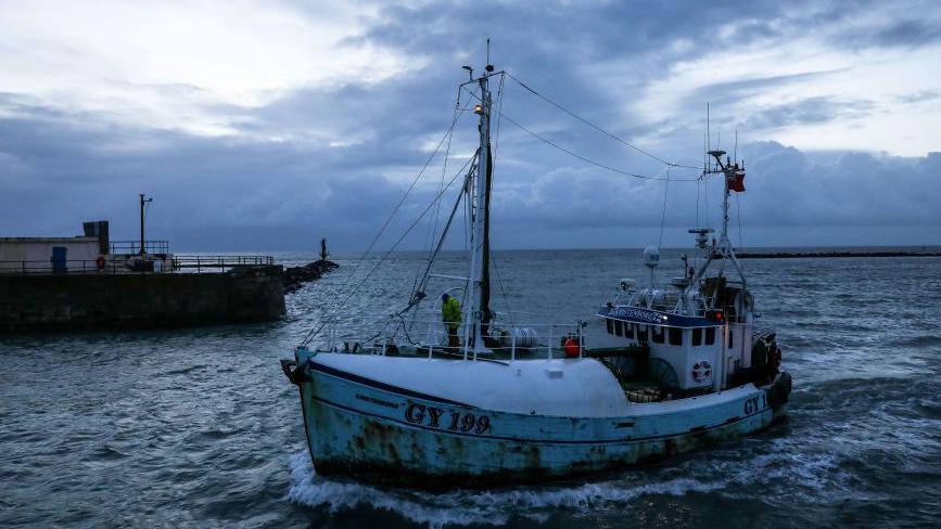 A fishing boat returns from the English Channel to Ramsgate Harbour in Ramsgate