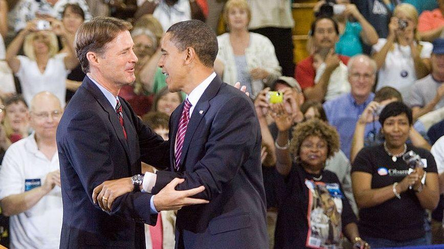 Evan Bayh, U.S. senator from Indiana, left, embraces Barack Obama