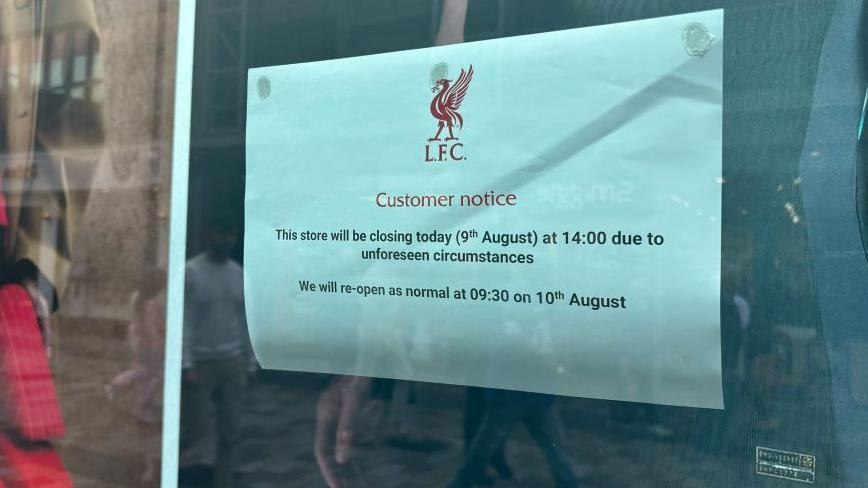 A notice stuck in the window of the Liverpool Football Club 