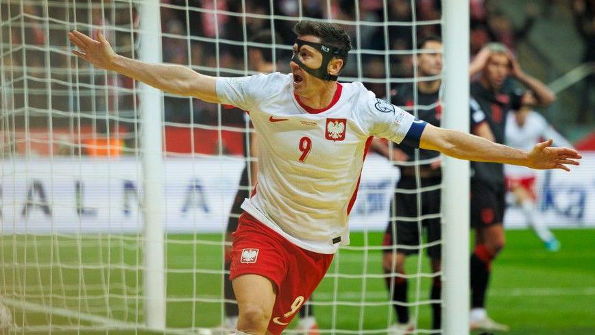 Robert Lewandowski celebrates scoring for Poland against Albania in a World Cup qualifying play-off semi-final