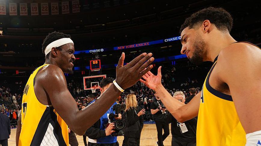Pascal Siakam celebrates with Tyrese Haliburton