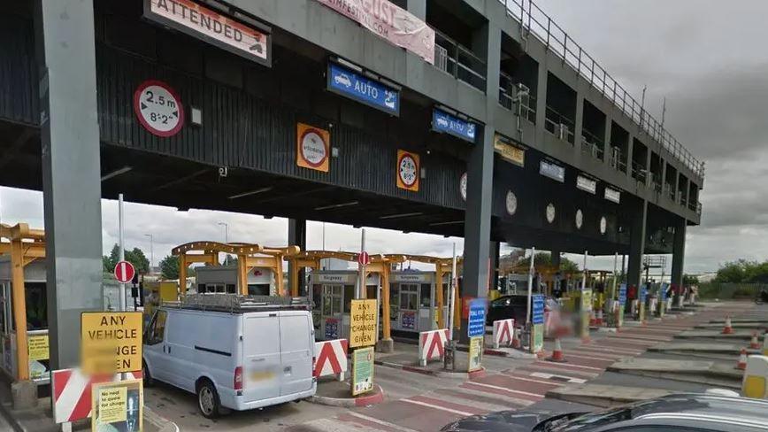 Vehicles at the Mersey Tunnel toll booths to pay for using the tunnels