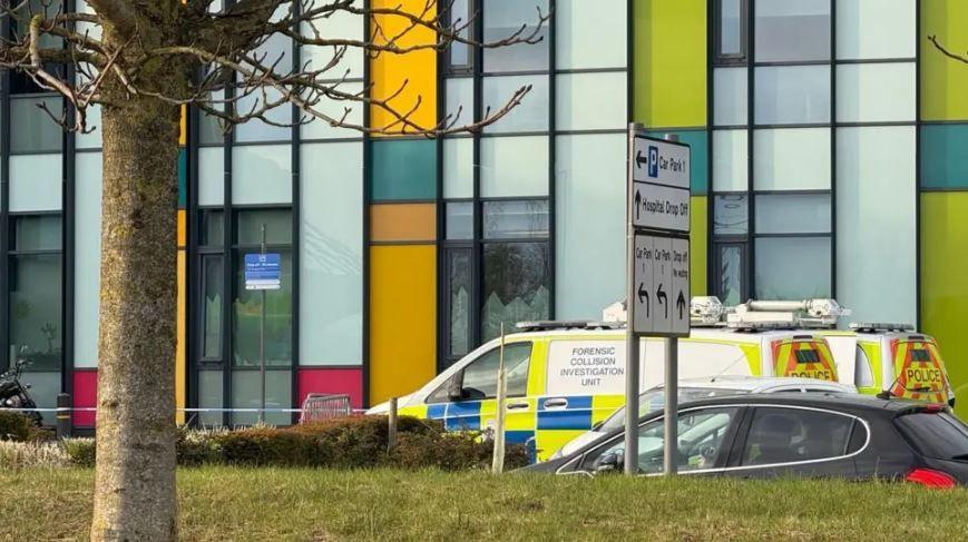 Image of a police cordon and a forensic collision investigation unit van outside the hospital.