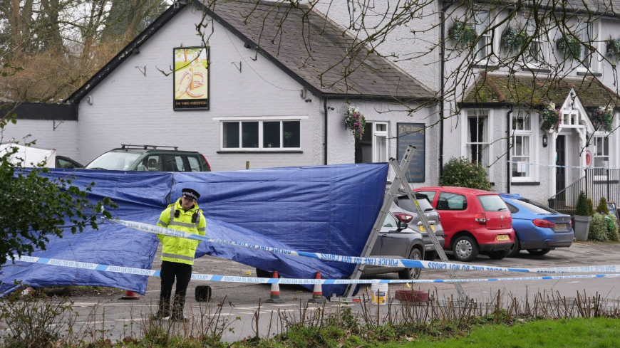 A police cordon at the Three Horseshoes pub in Knockholt, Kent, after police were called on Friday amid reports a woman had suffered serious injuries